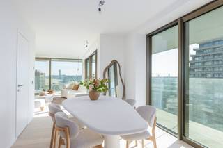 New construction project TROON 17 Ostend brings an architecturally innovative project to the seafront with a nod to the site's rich history.This apartment has 2 bedrooms, 2 bathrooms, beautiful terraces and side sea views. Apartment type layout:- entrance hall- living room with open kitchen- storage- bathroom 1 with walk-in shower and washbasin furniture- bathroom 2 with walk-in shower and washbasin furniture- separate toilet- bedroom 1- bedroom 2- surrounding terrace Finishing apartments with side sea view:- parquet- kitchen with Miele appliances- floor heating- heating via heat network (= renewable energy)- ventilation system DIn the basement, it is possible to purchase garages or parking spaces. A spacious bicycle shed is also provided.*Plans and details of prices available at the office, contact us on 059 50 60 50 for an appointment.