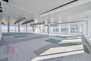 Exceptional office building of 2578 m² is part of the high-quality ‘Atmos’ office complex, consisting of five BREEAM OUTSTANDING-certified buildings. These offices are ready to move in and are located in green surroundings with a car-free courtyard. Thanks to the attention to architecture and functionality, these sustainable offices are the ideal environment for innovation and collaboration in Ghent. The offices are future-oriented and comply with upcoming strict European regulations, such as the EU taxonomy. The complex offers ample underground parking facilities, including charging stations, and a public car park under construction, with completion scheduled for January 2025.<br /><br />The building is strategically located on the R4 ring road around Ghent, just 4 minutes' drive from the E40 on-ramp and exit Sint-Denijs-Westrem and 7 minutes from the E17. Sint-Pieters station is 1.6 km away, which is an 8-minute bike ride or a 22-minute walk. In addition, a tram stop is just 900 metres away. The office building also offers excellent visibility from the R4, contributing to its prominent location.<br /><br />For more information, the specifications or a no-obligation site visit, please contact PANORAMA B2B GENT KANTOREN on 09 225 09 02.