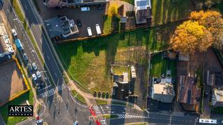 Projectgrond van 20a21 voor een handelspand van 454,29 m² en 3 appartementen, gelegen op de hoek van de Rijksweg en de Kerkstraat in...