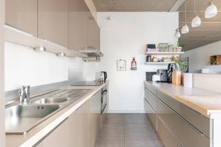 This exceptional loft apartment is located in a characterful brutalist building in a prime location on Antwerp's Eilandje. The exposed...