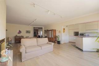 <p><span>Between three parks, with the city nearby and yet remarkably quiet: this third-floor apartment combines sun, sight and space with two terraces and a thoughtful layout. A comfortable and well-kept unit, complemented by a basement storage room and the possibility of a garage box.</span></p><p><span>Living space full of light</span></p><p><span>Through the entrance hall you immediately step through elegant glass doors into the generous living space. Large windows allow daylight to flood in abundantly and give the room an open, pleasant atmosphere. There is effortless room for a spacious dining table and a cozy sitting area, ideal for dinners with friends or relaxing evenings. The front terrace connects nicely to this, providing a nice outdoor spot with a view of the street.</span></p><p><span>Open kitchen, practical and inviting</span></p><p><span>There is also the open kitchen, which fits nicely into the living space. It is equipped with standard appliances, finished with a neat tiled floor and offers sufficient work and cupboard space for daily comfort. Thanks to the natural light, the kitchen also feels fresh and pleasant. Adjacent is a separate laundry room/storage area with the utilities: conveniently organized and neatly out of sight.</span></p><p><span>Peace and quiet in the back &amp; extra comfort</span></p><p><span>To the rear are two full-sized bedrooms, quietly located and with fantastic views of the greenery. The master bedroom has a large sliding window to the rear terrace, where you enjoy open and green views. The second room is perfect for use as an extra bedroom, dressing room, hobby room or home office and also opens onto the terrace. The bathroom is practically equipped with a double sink, bathtub with shower and ventilation. There is also a separate toilet and additional built-in storage space. The apartment also includes a private cellar storage room. Moreover, there is no shortage of parking possibilities; the garage box to be purchased is ideal for this (€30,000).</span></p><p><span>Green living, easily connected</span></p><p><span>The location in Deurne-South is undoubtedly a strong asset. You live right here between the Rivierenhof, the Te Boelaer Park and the Boekenberg Park,  ideal for those who love the outdoors, sports or relaxing in green surroundings. At the same time you are close to the Singel and the Ring, with streetcar and bus connections nearby and stores and restaurants within walking and cycling distance. A pleasant living environment with everything within easy reach.</span></p><p><span> </span></p>
