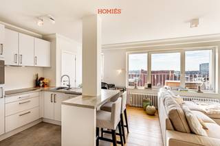 Located just a 5-minute walk from the historic center of Leuven, this fully furnished one-bedroom apartment offers a pleasant combination of comfort and natural light, featuring a spacious terrace with open views. The apartment has a surface area of approximately 60 m² and is situated on the fifth floor, accessible by stairs or elevator. Upon entering, you are welcomed into a bright living area with an open, fully equipped kitchen. The space is practically arranged and offers all necessary comfort. The bedroom is quietly located at the rear of the building. The bathroom is equipped with a sink, walk-in shower, and toilet. The apartment is rented fully furnished and includes, among others, a washing machine, combi-oven, coffee machine, toaster, cutlery, mattress, and duvet. Bike storage is available, and maintenance and cleaning of the common areas are included. Rent: €1,450 per month, plus €150 for heating and hot water. Electricity is to be arranged individually. Available right away. For more information: info@homies.be