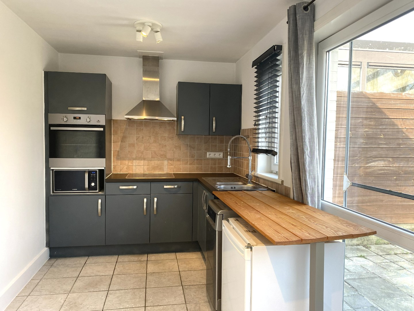 RIJWONING MET 3 SLAAPKAMERS EN TUIN NABIJ HET CENTRUM - foto 4