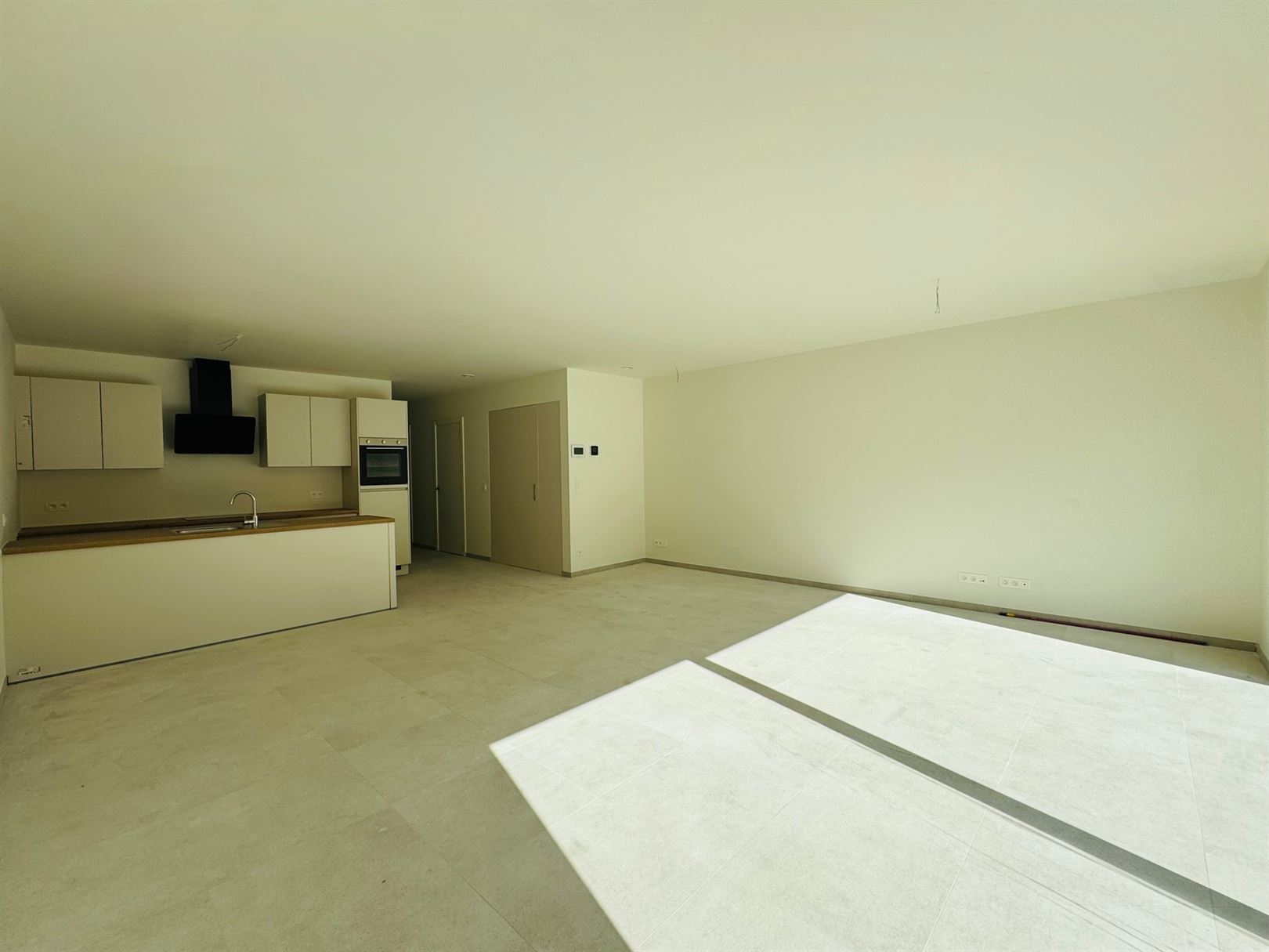 Gelijkvloers appartement met tuin, terras en autostaanplaats - foto 1