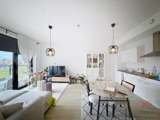 ANDERLECHT: Vlak bij de Kanaaldijk en alle voorzieningen, mooi appartement met 1 slaapkamer in een recent gebouw van ±62 m², gelegen op de...