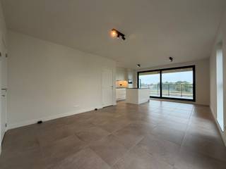 <p><strong>New-build 3-bedroom apartment with a terrace overlooking green surroundings in Oud-Turnhout.</strong> • Parking included • EPC label A • Common charges (advance payment): €100/month • Available immediately</p>
<p><strong>Location</strong><br />This apartment is located in a new residential development in Oud-Turnhout, on Klokbekererf, a quiet no-through road in green surroundings. Both the centre of Oud-Turnhout and the Grote Markt in Turnhout are approximately 2 km away.</p>
<p><strong>Layout</strong><br />Entrance hall • hallway • separate toilet • living area with dining area and open-plan kitchen • storage room with washing machine connection • three bedrooms • bathroom with bath, shower and double washbasin • terrace.<br />Two parking spaces in the underground car park come with the apartment (P19 and P20).</p>
<p><strong>Description</strong><br />The apartment is on the second floor and easily accessible by lift. It offers 94 m² of modern, energy-efficient net living space. The bright living area is the heart of the home and flows naturally into the dining area and open-plan kitchen. From the living area, you step out onto the 13.10 m² terrace, with sweeping views over the fields behind the building.<br />The three bedrooms offer space for a family, a guest room or a home office. The bathroom with bath, shower and double washbasin keeps the morning rush comfortable. Your cars are safely parked in the underground car park.<br />As a nearly zero-energy (BEN) apartment with EPC label A and an E-level of E12, this apartment keeps your energy bills exceptionally low.</p>
<p><strong>Highlights</strong></p>
<ul>
<li>New build in a quiet, green residential development</li>
<li>Nearly zero-energy (BEN) apartment with EPC label A (E12)</li>
<li>Terrace with sweeping views over the fields</li>
<li>Two underground parking spaces</li>
<li>Lift in the building</li>
<li>Common charges (advance payment): €100/month</li>
</ul>
<p><em>Living area according to the plans received.</em></p>