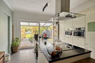 <p>This apartment with commercial space in Hasselt offers a distinctive combination of comfortable living, professional opportunities and a pleasant outdoor area. The property is located on Kempische Steenweg, one of the main access roads towards the centre of Hasselt. This prominent location provides excellent accessibility and strong visibility at the front, while the rear of the property offers a surprisingly peaceful and green setting. The outdoor area measures 1a67 and faces west, allowing you to enjoy the afternoon and evening sun.<br />The total living area of 104m² has been arranged in a practical way, with a commercial space at the front and a spacious, move-in-ready apartment behind it. The private part of the property underwent a thorough renovation in 2020. The kitchen, bathroom, windows, flooring, electrical installation, utilities, gas boiler and shutters were all renewed. The use of contemporary, high-quality materials creates a stylish and welcoming interior that is ready to enjoy from day one.<br />The living room is bright and connects directly to the open kitchen. From here, you also have a pleasant view over the west-facing garden. This green outlook creates a sense of calm and space despite the property's lively location along one of Hasselt's main access roads. The spacious bedroom and modern bathroom complete the private living area and provide a comfortable layout for everyday life.<br />At the front of the property, the space is currently used as a commercial unit. Thanks to its position along Kempische Steenweg, it benefits from significant passing traffic and excellent visibility. A parking space directly in front of the property provides convenient access for customers and visitors. However, the front space does not necessarily have to remain commercial. It can also be fully incorporated into the apartment and used as additional living space, a home office, hobby room or another flexible area according to your needs. This gives the property an adaptable character and allows you to shape the layout around your own plans.<br />At the rear, the green outdoor area of 1a76 provides a pleasant private setting away from the activity of the road. Its west-facing orientation means you can enjoy the sun later in the day, creating an inviting place to relax after work or spend time outdoors. The property therefore combines strong visibility and accessibility at the front with privacy and greenery at the rear.<br />Thanks to the complete renovation in 2020, central location in Hasselt, excellent commercial visibility and flexible layout possibilities, this is a versatile property with plenty of potential. You can continue to use the front space for commercial purposes or integrate it fully into the apartment to create additional living space. Come and discover the possibilities this property has to offer. A versatile apartment for those looking to combine comfortable living with additional space and possibilities. Discover the property's many advantages for yourself during a viewing.</p>