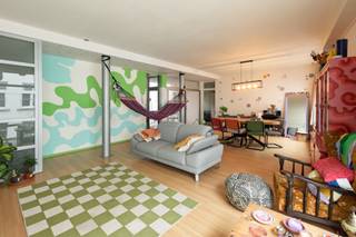 Located on Ambtmanstraat, in a central location within walking distance of shops, restaurants, and public transport, this two-bedroom apartment is a true hidden gem in the heart of the city.<br /><br />Upon entering, you are immediately welcomed by the spacious and light-filled living area. The open-plan living room, featuring wooden flooring, seamlessly combines the lounge and dining areas, creating a warm and inviting atmosphere.<br /><br />Adjoining the living space is a charming terrace overlooking a peaceful green oasis in the middle of the city, the perfect spot to enjoy breakfast in the morning or unwind in the evening.<br /><br />The apartment offers two spacious bedrooms, both finished with wooden flooring. The bathroom features a double washbasin, a bathtub with handheld shower, and a separate toilet.<br /><br />The functional kitchen is fully equipped, while a separate utility room provides additional convenience with space for a washing machine and tumble dryer.<br /><br />An ideal property for anyone looking to enjoy city living in a prime central location in Antwerp.