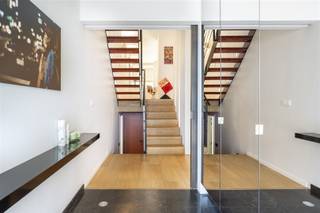 <p><span>WILRIJK - Elsdonk: Luxurious and spacious villa with 5 bedrooms and 4 bathrooms, high-quality finish in the sought-after Elsdonk neighbourhood. EPC label C.</span></p><p><span> </span></p><p><span>This exceptional villa is located in one of the most sought-after neighbourhoods of Antwerp, tucked away in the greenery of the Elsdonk neighbourhood. </span></p><p><span>The location is ideal for those who love peace and privacy, but still want easy access to the city centre and major roads.</span></p><p><span>This property combines modern comfort with thoughtful architecture and was further renovated in 2023. The result is a contemporary home with a particularly pleasant atmosphere and an abundance of space.</span></p><p><span>This unique property is the perfect choice for those looking for an exclusive, ready-to-move-in villa with high-quality finishes, in a green yet sought-after neighbourhood.</span></p><p><span> </span></p><p><span>DESCRIPTION:</span></p><p><span> </span></p><p><span>Ground floor:</span></p><p><span>Entrance hall with designer guest toilet and cloakroom.</span></p><p><span>Pleasant, open and light-filled living room with parquet flooring and impressive ceiling height, opening via sliding windows onto the large terrace and the beautifully landscaped south-facing garden with plenty of privacy. </span></p><p><span>Fully equipped and luxurious kitchen with cupboards and all appliances, including a beautiful Lacanche stove.</span></p><p><span>There is also an office, a separate lounge and a practical laundry room.</span></p><p><span>Indoor garage for 1-2 cars + driveway.</span></p><p><span> </span></p><p><span>1st floor:</span></p><p><span>Built-in office space with a view over a mezzanine.</span></p><p><span>Impressive master bedroom with adjoining dressing room and very luxurious bathroom with jacuzzi, shower and two washbasins.</span></p><p><span> </span></p><p><span>2nd floor:</span></p><p><span>Four bedrooms and three bathrooms.</span></p><p><span>Large multipurpose room, currently used as a TV room for the children.</span></p><p><span> </span></p><p><span>SPECIAL FEATURES:</span></p><p><span> </span></p><p><span>* Residential location, close to access roads</span></p><p><span>* Luxurious finishings</span></p><p><span>* Indoor garage</span></p><p><span>* Beautiful garden with lots of privacy</span></p><p><span>* Air conditioning throughout</span></p><p><span>* Sought-after location in the Elsdonk neighbourhood</span></p><p><span> </span></p>