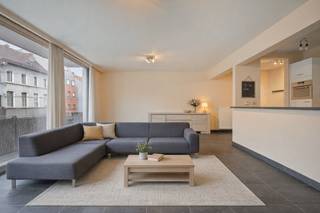 This bright 95 m² apartment is located on the first floor of a well-kept building and combines space, comfort and a very convenient location.The pleasant living and dining area enjoys plenty of natural light and connects to an open, fully equipped kitchen with hob, extractor, oven, dishwasher and built-in fridge with freezer. Large sliding windows provide access to a terrace across the full width of the living space.The apartment also has two bedrooms, a bathroom with a double sink and bath, a separate toilet and a practical storage room with a washing machine and dryer connection. Bicycle storage is available and the building is equipped with a lift.The apartment is part of Residentie Noordstar (built in 2006) and is located near the Oude Dokken and Dok Noord. The city center and station are easily accessible on foot or by bike (Dampoort about 1.6 km). Bus and tram stops are right outside the door, and there is also a quick connection by car via the R4.Mandatory to purchase: a parking space at the back of the building for €20,000.A comfortable and well located apartment, ideal for private living or as an investment.EPC: 104 kWh/m²EPC: 104.0 kWh/m²EPC: 104.0 kWh/m²