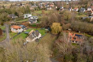 Deze prachtige bouwgrond ligt in woonparkzone en is 877 m² groot. Het perceel bevindt zich in een niet-vervallen verkaveling uit 1977. Voor...