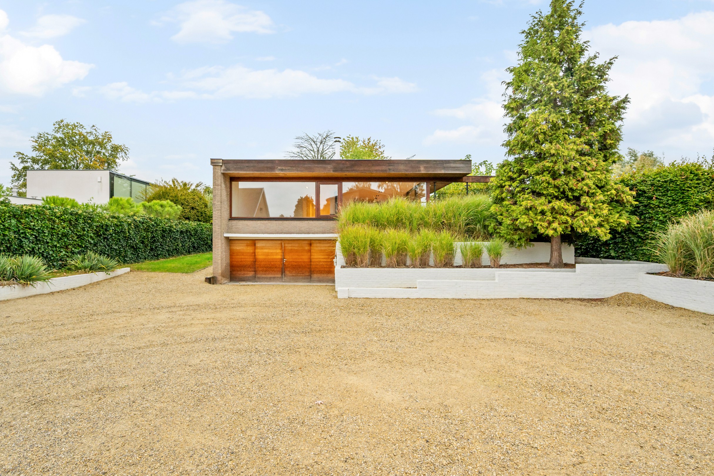 Villa avec étage de vie surélevé sur un magnifique terrain de 1 100 m² dans un quartier résidentiel à Hasselt. - photo 1