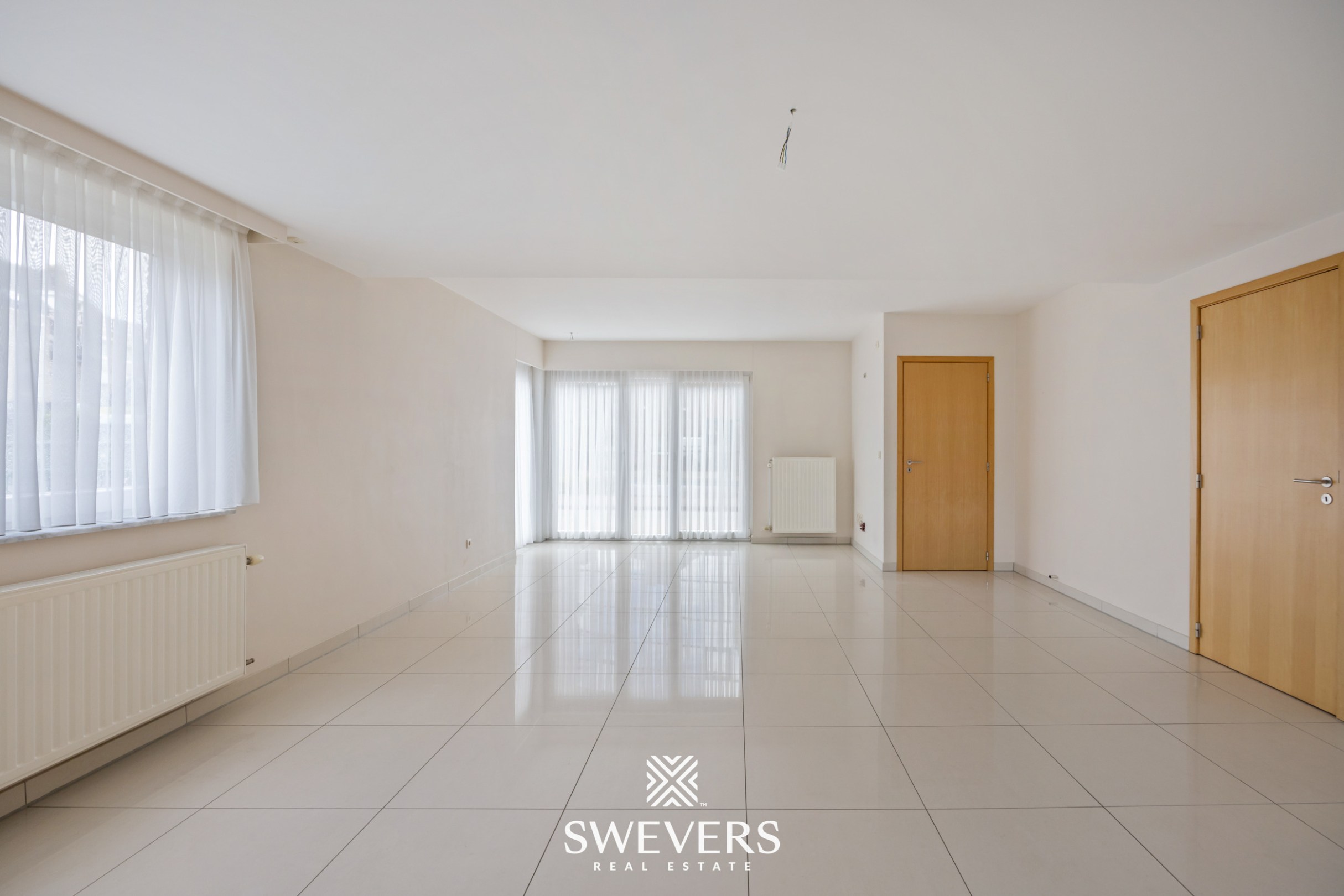 Uitstekend gelegen gelijkvloers appartement met 2 slaapkamers en private tuin - foto 4