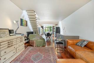 <p>Gerenoveerde woning met veel potentieel.<br /><br />Op zoek naar een stadswoning met karakter, verrassende volumes en een eigentijdse indeling? Deze bijzondere eengezinswoning in de Landbouwstraat in Antwerpen biedt een unieke woonbeleving waar licht, openheid en flexibiliteit centraal staan.<br /><br />Gelegen in een levendige en centraal gelegen buurt, geniet je hier van alle stedelijke voorzieningen binnen handbereik. Scholen, winkels en horecazaken bevinden zich op wandelafstand, terwijl openbaar vervoer en belangrijke invalswegen zorgen voor een vlotte verbinding naar het stadscentrum en daarbuiten.<br /><br />Bij het binnenkomen word je verwelkomd in een inkomhal met vestiaire en een apart gastentoilet. Aansluitend bevindt zich een polyvalente ruimte die momenteel dienstdoet als wasplaats maar zich perfect leent als bureau, praktijkruimte of hobbykamer. Achteraan bevindt zich een sfeervolle slaapkamer met eigen douche en directe toegang tot een gezellig terras. Een rustige plek om even te ontsnappen aan de dynamiek van de stad.<br /><br />Op de eerste verdieping vormt de leefruimte met open keuken het hart van de woning. De keuken is ingericht met een royaal centraal eiland dat niet alleen veel werkruimte biedt, maar ook uitnodigt tot samen koken en tafelen. Dankzij het grote schuifraam vloeien binnen- en buitenruimte mooi in elkaar over en geniet je van een knus terras waar plaats is voor een ontbijttafel of een etentje in de avondzon.<br /><br />Via de moderne trap bereik je de mezzanine, waar de woning haar meest eigenzinnige karakter prijsgeeft. De open slaapkamer beschikt over handige ingemaakte kasten en sluit aan op de badkamer die centraal in de ruimte werd geïntegreerd. Achter de badkamer bevindt zich nog een gezellige lees- en zithoek die uitkijkt over de leefruimte. Ideaal om tot rust te komen.<br /><br /><strong>Troeven:</strong></p>
<ul>
<li>Karaktervolle stadswoning met verrassende indeling</li>
<li>Centrale ligging in Antwerpen nabij scholen, winkels en horeca</li>
<li>Vlotte verbinding met openbaar vervoer en belangrijke invalswegen</li>
<li>Polyvalente ruimte op het gelijkvloers, ideaal als bureau of praktijk</li>
<li>Gezellig terras aansluitend aan de leefruimte</li>
<li>Sfeervolle mezzanine met slaapkamer, ingerichte badkamer en leeshoek</li>
</ul>
<br />Wil je deze woning met al zijn mogelijkheden komen ontdekken? Maak snel een afspraak voor een bezoek ter plaatse.