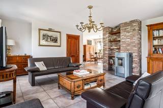 <p><span>Spacious home with a separate practice – or office space</span></p><p><span> </span></p><p><span>This versatile property, consisting of a semi-detached and a detached building, is quietly located near the train station and schools. The home combines comfortable living with a separate practice, office, or living area and offers numerous possibilities for self-employed individuals, professionals, or those living with their children.</span></p><p><span>The semi-open section includes an entryway with a guest restroom, a bright living area with a living room and dining room, a fully equipped kitchen, and a spacious storage room. </span></p><p><span>Upstairs, there are 3 spacious bedrooms, a bathroom with a bathtub, shower, and double sink, a separate toilet, and two insulated attics with the potential for a fourth bedroom.</span></p><p><span> </span></p><p><span>The separate, enclosed unit features its own entrance with a waiting room/office space and a restroom. This section can be perfectly configured as a practice space, office, apartment, or granny flat. It also includes a spacious living or office area, a kitchen, and a bathroom (still to be finished), as well as a large multipurpose room on the upper floor. A heat pump and air conditioning are installed.</span></p><p><span> </span></p><p><span>Highlights</span></p><ul><li><span>EPC rating B </span></li><li><span>Asbestos-safe certificate </span></li><li><span>3 to 4 bedrooms + possibility of an additional one</span></li><li><span>Separate practice/office area with its own entrance </span></li><li><span>Heat pump and air conditioning available </span></li><li><span>Quiet location near the train station and schools </span></li></ul><p><span> </span></p><p><span>An ideal property for those who want to combine living and working or are looking for a home with additional possibilities.</span></p><p><span> </span></p>