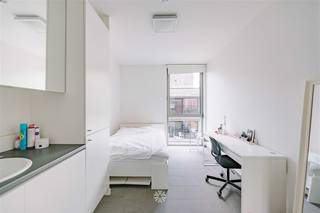 GENT CENTRUM - Trendy studentenkamer op uitstekende locatie Deze interessante investeringsopportuniteit is gelegen op de tweede verdieping van...