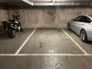 SCHAERBEEK, 181 Voltaire Avenue in ‘La Résidence du Parc’, an indoor parking space with remote control. Rent: €110/month. Available...
