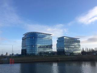 The 587 m² offices for rent in the prestigious ‘Blue Towers’ office building in Ghent offer a phenomenal location with numerous advantages. The location is strategic, close to the R4 and the major cloverleaf interchange, ensuring excellent accessibility. <br /><br />The turnkey offices are located both on the first floor of this modern building. They are fully furnished to the latest standards and equipped with innovative techniques, contributing to an efficient working environment. The large glazed areas provide an abundance of natural light, offering stunning views of the surrounding water bodies. <br />The building itself exudes class and professionalism and is equipped with all modern amenities.<br />The BREEAM Excellent certificate underlines Blue Towers' sustainability and energy efficiency, which is an additional asset for companies that value a green image. In addition, the parking ratio is particularly favourable.<br /><br />With different surface areas available, there is flexibility for businesses of varying sizes. In short, this is a godsend for organisations looking for office space that not only excels in terms of accessibility, but also has a representative appearance. For more information, technical details or a site visit, please contact PANORAMA B2B GENT KANTOREN on 09 225 09 02.