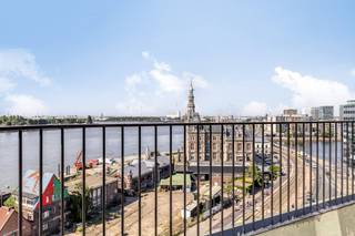 General Features:- new build project in top location in Antwerp- terrace with unique views of the Scheldt and the Linkeroever marina - underfloor heating- microtopping and customization option- solar panels- partly sales under registration, partly under VATLayout 9th floor- entrance hall with separate toilet - Eating kitchen with panoramic views of the City. - spacious living space with unique view of the Scheldt and Left Bank- storeroom- open terrace- stairs down 8th floor- night hall- open room which can be furnished as a desk, library or third bedroom- terrace with screwing system- master bedroom at the quiet back with ensuite dressing- bathroom with walk-in shower and double sink- front bedroom with terrace access- shower room- separate toiletMicrotopping “Less is More”This new build project in Antwerp offers several additional options for finishing such as microtopping. Microtopping is a perfect choice for those who love a seamless surface, vertically or horizontally for a unique, elegant and modern look. An endless choice of colours, effects and finishes. Even MoreGoplus gives you even more options in Rivert, which is to fully customize the overall interior. This ranges from an integrated wood veneer wall to partitions, dressing and doors. The sky's the limit! Sales under VAT system.Are you interested in new construction, apartment or property for sale in Antwerp? Please don't hesitate to contact us.If you would like to offer your own property for sale please contact us for a non-binding estimate, by phone at 03/206.76.76 or by email to antwerpen@dewaele.com. You can also contact us for all other questions about real estate, buying or selling in Antwerp.