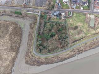 Ontdek de perfecte plek om te wonen in harmonie met de natuur! Dit prachtige perceel van 6.257 m² biedt een adembenemend uitzicht op de Schelde...