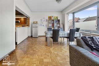 Spacious and bright apartment of approx. 100 m² near the center of Sint-Niklaas.The property includes a large living space with fully continuous front window, a southwest-oriented terrace and two full, very bright bedrooms.The apartment has natural gas central heating, double glazing, a private garage and is located in a building with elevator.Quiet location within walking distance of downtown, with also a large additional parking lot at the back of the neighborhood for additional parking.Interesting offer for those looking for a spacious and well-located apartment.Contact us for a visit.