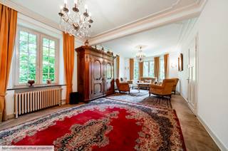 We Invest Malmedy is pleased to present this elegant, characterful villa in the style of a mansion, ideally located on Avenue du Pont de Warche in Malmedy. Set on a lot accessible via a private driveway secured by a gate, this property offers a privileged living environment that combines tranquility and privacy with immediate proximity to shops, schools, and major highway routes. An ideal property for a family or as a second home.<br /><br />With approximately 233 m² of living space, the house captivates from the moment you enter with its magnificent foyer and period staircase. The ground floor features a recently fitted kitchen, a spacious, light-filled living area combining the living room and dining room, as well as a pleasant sunroom opening onto the garden and a half-bath. On the first floor, a landing leads to three large bedrooms (17, 15, and 16 m²), a fully renovated bathroom with a walk-in shower, and a charming loggia. The second floor features a second bathroom and a superb 55 m² master suite with a living area and a converted attic.<br /><br />The basement occupies the entire lower level of the house and offers numerous storage cellars. An outbuilding consisting of several garages completes the property and provides particularly valuable storage space.<br /><br />From a technical standpoint, the property features an insulated roof renovated in 2007, double-glazed PVC window frames replaced in 2023, a kitchen installed in 2022, an up-to-code electrical system, and oil-fired central heating. The southwest-facing garden allows you to fully enjoy the sunshine throughout the day. The house is also equipped with a septic tank. The PEB certificate is rated Class E (353 kWh/m²/year – Total E: 101,144 kWh/year – Ref. 20260327002438), primarily due to the lack of certain documentation regarding insulation work.<br /><br />A charming property offering spacious rooms and high-quality features!<br />For more information and to schedule a viewing: 0499/66.71.45 – malmedy@weinvest.be