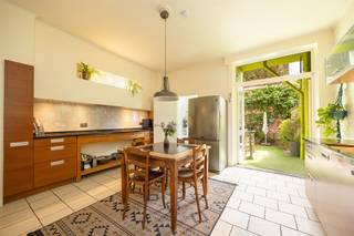 <p><span>Quiet living on the edge of Borgerhout and Zurenborg, within walking distance of everything that makes the city so nice. This surprisingly spacious home combines authentic elements with playful colors, lots of light and a fine green outdoor space. A warm home with character, spread over several full-fledged floors.<br /><br /></span></p><p><span>Warm character & smart layout</span></p><p><span>On the ground floor, you are welcomed through the entrance hall where the sandblasted staircase immediately stands out. In front is the cozy living space with high ceilings, parquet flooring and wall-to-wall windows. To the rear is the spacious kitchen (ALNO) with natural stone worktop, wooden cabinets, combination oven, dishwasher, gas hob and zelliges tiles. Adjacent you will find the first of three bathrooms that doubles as a laundry room and access to the southeast facing city garden, a lovely quiet spot with little privacy.<br /><br /></span></p><p><span>Floors full of possibilities</span></p><p><span>The second floor is large multipurpose room with modern fireplace: ideal as additional living space, studio or office. You will also find a bedroom with ensuite bathroom in blue mosaic tiles and dressing room, and access to a sunny terrace. On the second floor there are two more full bedrooms and a third bathroom. The spacious, dry basement provides additional storage space.<br /><br /></span></p><p><span>Zurenborg & neighborhood</span></p><p><span>This home is located on a quiet street just off Zurenborg on the outskirts of Borgerhout, between the Stadspark and Rivierenhof. All amenities are within walking distance: local stores, restaurants, public transport and easy access and exit roads via the Plantin and Moretuslei. An ideal mix of tranquility, greenery and city life.</span></p><p><span> </span></p>