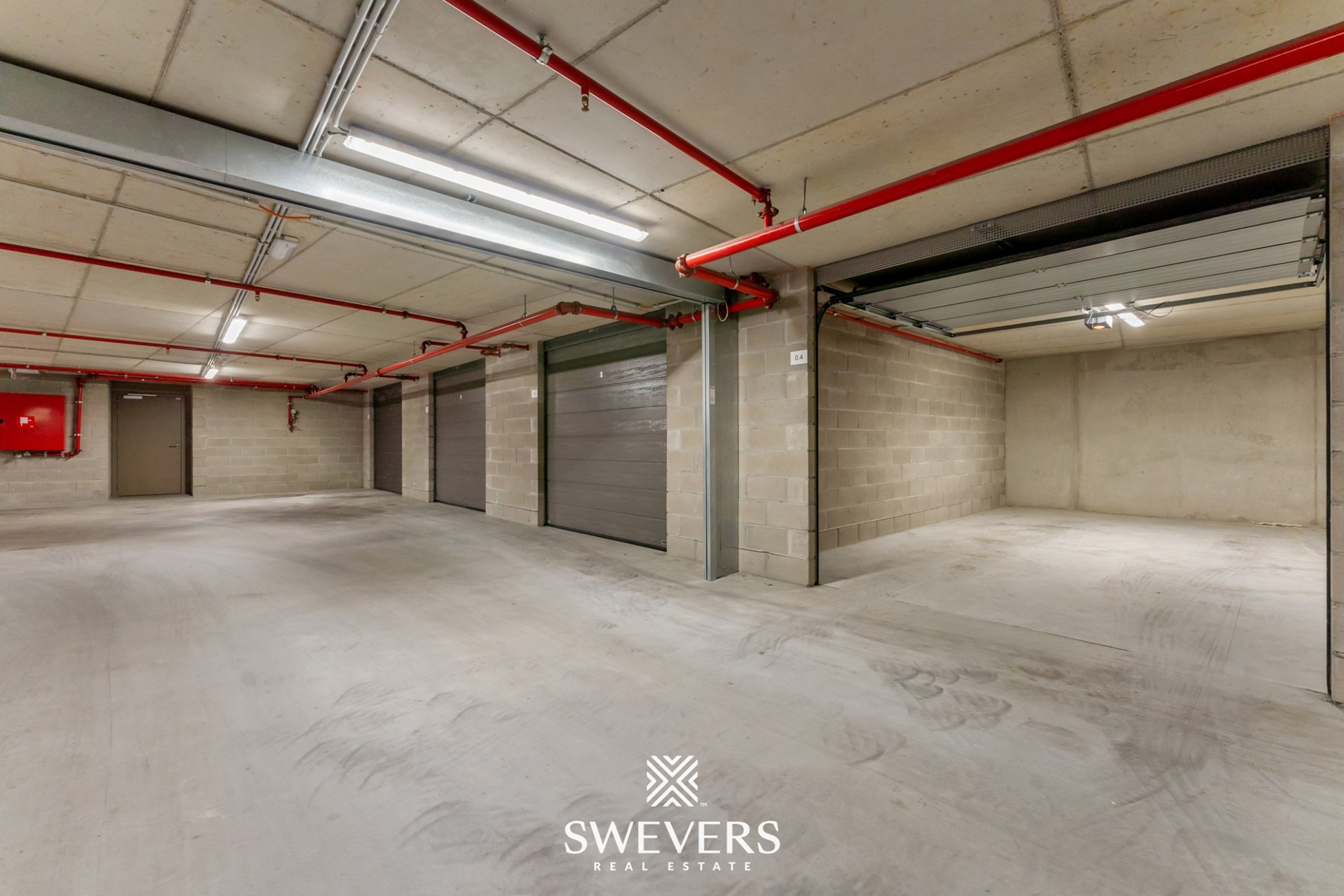 Ruime en beveiligde ondergrondse garagebox te huur in Quartier Blue - foto 1