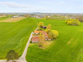 <p>Farmhouse to renovate or demolish, ideally located in an exceptionally quiet and rural setting, surrounded by vast fields and enjoying beautiful open views.<br /><br />This property offers a rare opportunity for those dreaming of countryside living with maximum freedom. The 2,755 m² plot provides an excellent basis for a renovation project or a complete rebuild. The existing outbuildings offer additional possibilities, such as storage or custom-built annexes to suit your plans.<br /><br />The open surroundings create a strong sense of space, peace, and privacy, while the property remains easily accessible.<br /><br />An additional asset is the possibility to purchase an extra plot of approximately 500 m². Moreover, an approved change of use from agricultural to residential with residential outbuildings is already in place, making this property particularly attractive for future-oriented building or investment projects.<br /><br />A unique opportunity for lovers of outdoor living looking for a project full of character and potential.<br /><br />More information or to schedule a visit: wim@immobeguin.be<br /><br />For sale via Immo Beguin, your real estate expert since 2009, with offices in Ronse, Waregem, Kortrijk, Deinze, Tournai, and Lessines.</p>