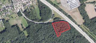 Een perceel bosgrond van in totaal 14.595 m² gelegen te Kwaadmechelen (Tessenderlo-Ham), ter plaatse gekend Genebemden Bemden en gesitueerd nabij het op- en afrittencomplex E 313 nummer 25 Ham. De begroeiing bestaat uit een gevarieerd bomenbestand met o.a. Amerikaanse eik, grove den, vogelkers,... Gekend op het gewestplan als natuurgebied.