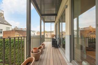 <p><span>Trendy apartment in historic city center</span></p><p><span> </span></p><p><span>A trendy apartment with terrace and lots of light. Living room on parquet floor with separated desk-loft corner (Can also serve as 2nd bedroom if necessary). </span></p><p><span>Open kitchen equipped with appliances. Storage room. Separate toilet. </span></p><p><span>Bathroom with shower in bath. </span></p><p><span>1 spacious bedroom. </span></p><p><span> </span></p><p><span>Additional's: </span></p><ul><li><span>Lovely terrace overlooking beautifully landscaped courtyard garden.</span></li><li><span>Favorable EPC</span></li><li><span>Electricity conform</span></li><li><span>Indoor parking possible to purchase for €27,000,- (not required)</span></li></ul>