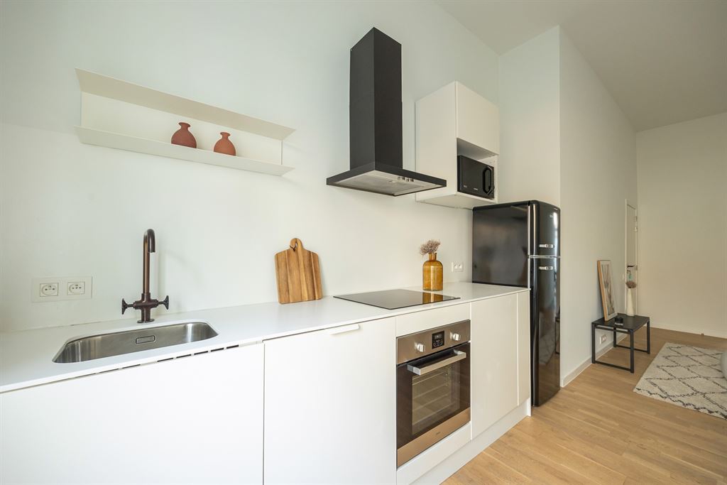 Gerenoveerd gelijkvloers appartement met stadstuin - foto 3