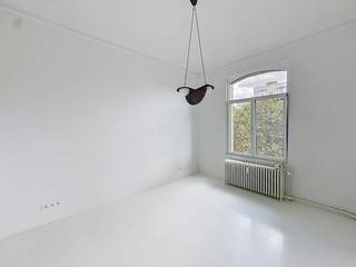 Brussels: Spacious apartment (162 m²) with 2 bedrooms in the city center. This apartment offers all the necessary comfort, large windows with plenty of natural light, and easy accessibility within the city.<br /><br />The apartment consists of an entrance hall with a cloakroom, a living room with a separate seating area, an open kitchen, and a large storage room.<br />Furthermore, this apartment has 2 spacious bedrooms, 1 of which features a walk-in closet and the other built-in wardrobes. The bathroom is equipped with a freestanding bathtub and a walk-in shower; additionally, there is a separate toilet.<br /><br />This apartment is beautifully finished with high-quality sustainable materials and has an EPC label E.<br /><br />Charges: 200 EUR/month for maintenance of common areas, property management, private heating, and hot water.<br /><br />Would you like to view this apartment? Please request an appointment via our website www.dewaele.com