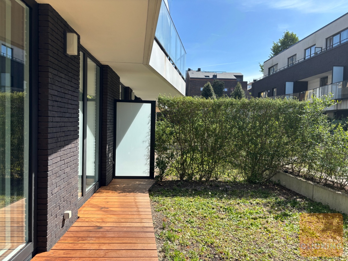 Tof 1 slaapkamerappartement met terras en tuintje - foto 2