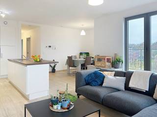 Modern en energiezuinig 2-slaapkamer appartement met veel licht en open verzicht. Het appartement omvat een inkomhal met gastentoilet, leefruimte...