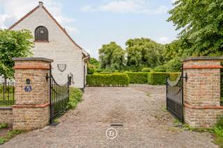 Located in picturesque Lissewege, this charming fermette sits on a spacious lot of 2,724 m². With a living area of 282 m², the home offers a harmonious blend of space, light, and nature, where indoor and outdoor living flow seamlessly into one another.<br /><br />The home was carefully designed to blend into its green surroundings and, with its large windows, faces entirely toward the surrounding garden. From virtually every room, you can enjoy a soothing view of the greenery, while the abundant natural light lends the various living spaces a pleasant sense of openness.<br /><br />The central living area forms the heart of the home and features a cozy fireplace, authentic exposed wooden beams, and a direct connection to the garden. The functional layout on the ground floor ensures smooth circulation and a particularly comfortable living experience. The various living spaces flow naturally into one another, creating a warm, inviting atmosphere.<br /><br />A landscaped garden surrounds the home, offering complete privacy and tranquility. Thanks to its favorable southwest orientation, you can enjoy optimal natural light and sunny terraces all day long. The spacious lot also offers numerous possibilities for gardening enthusiasts, families, or anyone seeking an exclusive living environment with a strong sense of space.