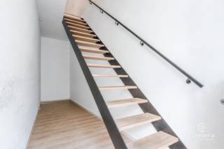 Exclusively renovated triplex apartment in the heart of Turnhout<br /><br />The living areas are accessed through the entry hall on the ground floor. The first floor features a stylish and spacious kitchen-dining area. The completely renovated kitchen is equipped with high-quality appliances and offers direct access to the cozy terrace.<br /><br />The second floor features a light-filled living room with impressive ceiling height, large windows, and a custom-built wall of cabinets. The laundry room, a guest restroom, and the stylish bathroom are also located here.<br /><br />On the third floor is the first spacious bedroom with a separate restroom. This floor also features a beautiful mezzanine overlooking the living room.<br /><br />The fourth floor features two additional bedrooms. The entire home is equipped with radiant floor heating, and all light fixtures, the custom-made curtains and blinds, as well as the freestanding kitchen island, are included in the sale.<br /><br />A unique added value is the option to purchase the commercial space below, which can serve perfectly as retail or office space but also offers the possibility—subject to the necessary permits—to integrate it into the home, thereby creating an exceptional combination of living and working.<br /><br />Finally, an underground parking space is optionally available on the adjacent Pieter Denefstraat.