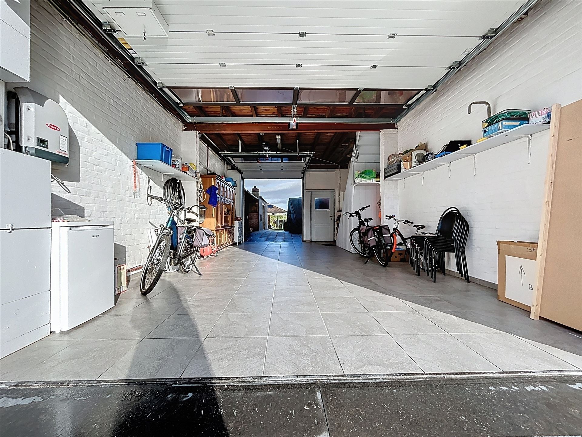 Halfopen woning met garage en tuin - foto 3