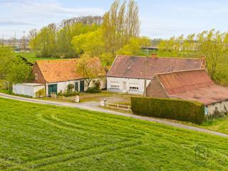 <p>Farmhouse to renovate or demolish, ideally located in an exceptionally quiet and rural setting, surrounded by vast fields and enjoying beautiful open views.<br /><br />This property offers a rare opportunity for those dreaming of countryside living with maximum freedom. The 2,755 m² plot provides an excellent basis for a renovation project or a complete rebuild. The existing outbuildings offer additional possibilities, such as storage or custom-built annexes to suit your plans.<br /><br />The open surroundings create a strong sense of space, peace, and privacy, while the property remains easily accessible.<br /><br />An additional asset is the possibility to purchase an extra plot of approximately 500 m². Moreover, an approved change of use from agricultural to residential with residential outbuildings is already in place, making this property particularly attractive for future-oriented building or investment projects.<br /><br />A unique opportunity for lovers of outdoor living looking for a project full of character and potential.<br /><br />More information or to schedule a visit: wim@immobeguin.be<br /><br />For sale via Immo Beguin, your real estate expert since 2009, with offices in Ronse, Waregem, Kortrijk, Deinze, Tournai, and Lessines.</p>