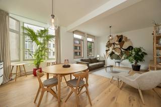 <p><span>ANTWERP - Jan Van Rijswijcklaan: Fully renovated, move-in ready and furnished 2-bedroom flat</span></p><p><span> </span></p><p><span>DESCRIPTION:</span></p><p><span> </span></p><p><span>This beautifully renovated and fully furnished flat is situated on the first floor of a well-kept and well-maintained building, located in a sought-after area on Jan Van Rijswijcklaan.</span></p><p><span> </span></p><p><span>You reach the flat via the authentic and stylish lift. </span></p><p><span>The entrance hall, featuring a guest toilet, leads into the spacious living area with open-plan kitchen. Thanks to the large windows, this space enjoys plenty of natural light and an open feel.</span></p><p><span>The modern kitchen is fully equipped with high-quality appliances and offers ample storage space, ensuring optimal convenience.</span></p><p><span>The flat has two bedrooms: </span></p><p><span>The master bedroom has an en-suite bathroom, which is fitted with a washbasin unit, a practical medicine cabinet, a spacious walk-in shower and a toilet. </span></p><p><span>The second bedroom offers ample space for comfortable furnishings. </span></p><p><span>As an added bonus, residents can make use of the communal roof terrace, which is a pleasant place to relax and enjoy beautiful views over the city of Antwerp.</span></p><p><span>A move-in ready flat that effortlessly combines comfort, quality, style and an excellent location.</span></p><p><span> </span></p><p><span>Private cellar storage included.</span></p><p><span> </span></p><p><span>Furniture available for €25,000.</span></p><p><span> </span></p><p><span>SPECIAL FEATURES:</span></p><p><span> </span></p><p><span>* Stunning views</span></p><p><span>* Move-in ready</span></p><p><span>* Electricity compliant</span></p><p><span> </span></p>