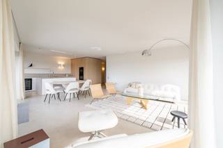 Stylishly Renovated Corner Apartment with Open Views and Ideal Orientation on Albert Square

Located in a prime position on the prestigious Albert Square, this beautifully renovated corner apartment offers open views, excellent sun exposure, and a high-end finish throughout. Bright interiors, quality materials, and a well-thought-out layout make this property a true gem by the sea.

Layout
Upon entering the apartment, you are welcomed into a well-appointed entrance hall with guest toilet and built-in cloakroom. The spacious living area benefits from abundant natural light thanks to its corner position, and opens onto two terraces facing south and southwest – perfect for enjoying the sun and partial sea views in complete privacy.

The open-plan kitchen blends seamlessly with the dining area and is equipped with top-of-the-line appliances by Miele, including a built-in wine cooler. High-quality materials and the use of polished concrete flooring throughout create a warm, modern atmosphere and a sense of space.

Sleeping Area
There are two full-sized bedrooms, each with custom-built wardrobes and a private en-suite bathroom or shower room. The bathrooms are finished with natural materials and fitted with premium design fixtures.

Additional Features
There is an option to purchase a private garage box in a nearby residence.

Key Features:

Unique corner location on Albert Square

Two sun-drenched terraces with sea view

Fully renovated with attention to detail

Polished concrete flooring throughout the apartment

Miele appliances and integrated wine cooler

Two bedrooms, each with a private bathroom

Optional private garage available

A move-in-ready property in a top location – ideal as a main residence or coastal second home.