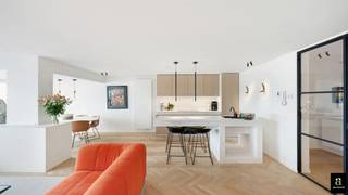 Luxuriously renovated flat on the Zeedijk, close to Rubensplein. The entrance hall is equipped with a cloakroom, a guest toilet and a laundry room. The spacious living room with frontal sea view (7m façade width), offers a bright living space that connects to a fully fitted open kitchen. The flat features two spacious bedrooms. The master bedroom has a dressing room and its own ensuite bathroom. The second bedroom features fitted wardrobes, a desk area and an en suite shower room.<br /><br />The recent renovation was carried out by the firm Chrisma, known for their high-quality finishes. The flat comes with two basement rooms and a bike shed on level -1.<br /><br />EPC: A-label (85) [1853112].