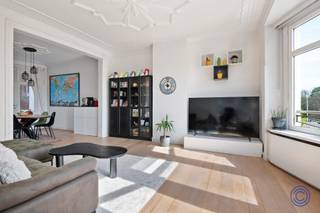 <p><span>Information Apartment</span></p><p><span>Discover this unique and characterful duplex apartment in the heart of vibrant Zurenborg the hotspot for those who love a vibrant, urban vibe with a creative and trendy feel. Located in a beautiful Art Deco building from 1925, this apartment combines authentic charm with contemporary comfort.</span></p><p><span> </span></p><p><span>Through the stylish entrance hall, you enter a light-filled living space where living and dining come together seamlessly. The large windows provide an abundance of natural light and green, restful views. The connecting west-facing terrace is the ideal place to relax with a drink in the evening sun after a busy day. The fully equipped kitchen offers every comfort and is practically connected to the dining area. </span></p><p><span> </span></p><p><span>Upstairs you will find a spacious master bedroom with dressing room, a second full bedroom and a modern bathroom with walk-in shower. With high ceilings, authentic elements and warm parquet floors, this apartment exudes character. Additional assets are the basement storage, compliant electricity and a favorable EPC label B. Located within walking distance of the Dageraadplaats and Draakplaats, with trendy bars, coffee bars, restaurants and stores just around the corner, you live here in the middle of one of Antwerp's most desirable neighborhoods.</span></p><p><span> </span></p><p><span>Layout</span></p><p><span> </span></p><p><span>Second floor</span></p><ul><li><span>Through the stately entrance hall on the second floor, equipped with checkroom, you enter this unique apartment. Thanks to the elegant steel glass doors, the hall enjoys a pleasant natural light. The beautiful wooden staircase immediately forms a stylish eye-catcher and leads you further upstairs.</span></li><li><span>The particularly spacious living space includes a bright living room and dining room with an adjoining office – ideal for home work. The large windows on the street side provide an abundance of natural light and offer a peaceful green view.</span></li><li><span>Adjacent is a cozy terrace of approx. 7 m² with west orientation, where you can enjoy the evening sun and the view of the surrounding gardens in peace.</span></li><li><span>The fully installed kitchen has all comforts: a large oven, induction hob with extractor hood, spacious fridge with separate freezer, dishwasher and plenty of work space. The practical pass-through hatch to the dining room provides additional convenience.</span></li><li><span>Furthermore, on this floor you will find a very spacious separate guest toilet with connections for washer and dryer.</span></li></ul><p><span> </span></p><p><span>Third floor</span></p><ul><li><span>The night hall provides access to all rooms and features a convenient, full-sized storage room.</span></li><li><span>The spacious master bedroom (approx. 19 m²) with adjoining dressing room exudes character thanks to its authentic moulures and elegant arches.</span></li><li><span>The stylish bathroom (renovated in 2014) is equipped with a spacious walk-in shower with rain shower, a double washbasin cabinet and a toilet.</span></li><li><span>There is also a second full-size bedroom of about 13 m².</span></li></ul><p><span> </span></p><p><span>Advantages</span></p><ul><li><span>This apartment combines space with authentic charm: high ceilings (approx. 3 m), original wooden floors, ornate moulures, arches and wrought iron elements create a unique living experience.</span></li><li><span>The living spaces are finished with elegant oak parquet flooring.</span></li><li><span>Additional storage space can be found in the very spacious, dry basement storage room included in the price.</span></li></ul><p><span> </span></p><p><span>General Information</span></p><ul><li><span>Monthly costs: 158 euros/month (PRIVATE water consumption of the apartment, maintenance and consumption of the common parts, elevator, trustee, insurance, etc.).</span></li><li><span>Reserve capital: 158 euros/month.0</span></li><li><span>Individual meters for electricity and gas.</span></li><li><span>Collective water meter with intermediate meters.</span></li></ul><p><span> </span></p><ul><li><span>EPC: label B.</span></li><li><span>Electrical inspection: in accordance with AREI.</span></li><li><span>Asbestos certificate: in application.</span></li></ul><p><span> </span></p><p><span>Building</span></p><ul><li><span>This beautiful building from 1925, designed by architect Robert Soebert in pure Art Deco style, exudes class and history. The imposing facade in white natural stone and handcrafted wrought iron details make an immediate impression. The communal entrance hall is also particularly stylish, with an impressive staircase and marble accents.The building includes private storage rooms, a photo studio on the ground floor and apartments on the upper floors.</span></li><li><span>Elevator available from the second floor.</span></li><li><span>Communal bicycle storage.</span></li><li><span>Intercom available.</span></li></ul><p><span> </span></p><p><span>Location</span></p><ul><li><span>Located in the trendy district of Zurenborg, within walking distance of the Draakplaats and Dageraadplaats.</span></li><li><span>Many bars, restaurants, stores and cozy parks in the immediate vicinity.</span></li><li><span>MOBISCORE: 9.5/10 an absolute top location for those who want to live urban and comfortable. </span></li></ul><p><span> </span></p><p><span>*The information in this prospect is for informational purposes only: prospective buyers should make their own business of obtaining, verifying and interpreting this information.</span></p>
