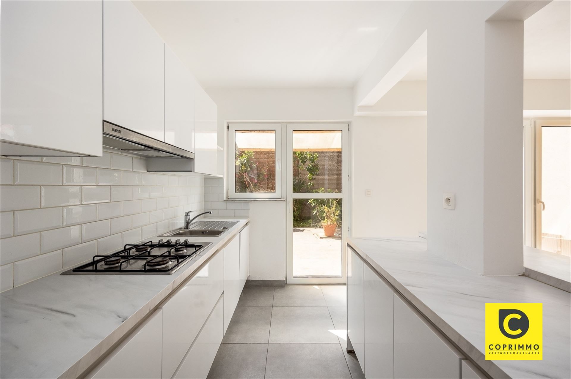 Instapklaar 3slpk appartement met tuin en garagebox ! - foto 4