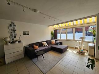 Cozy apartment with central location in Holsbeek. The bright living space flows into a kitchen equipped with cabinets and appliances. Next to the...