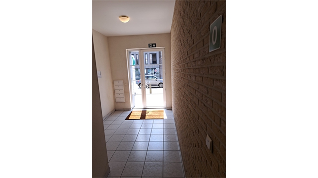 Een centraal gelegen opbrengsteigendom bestaande uit 5 appartementen, handelsgelijkvloers en 5 garages - foto 5