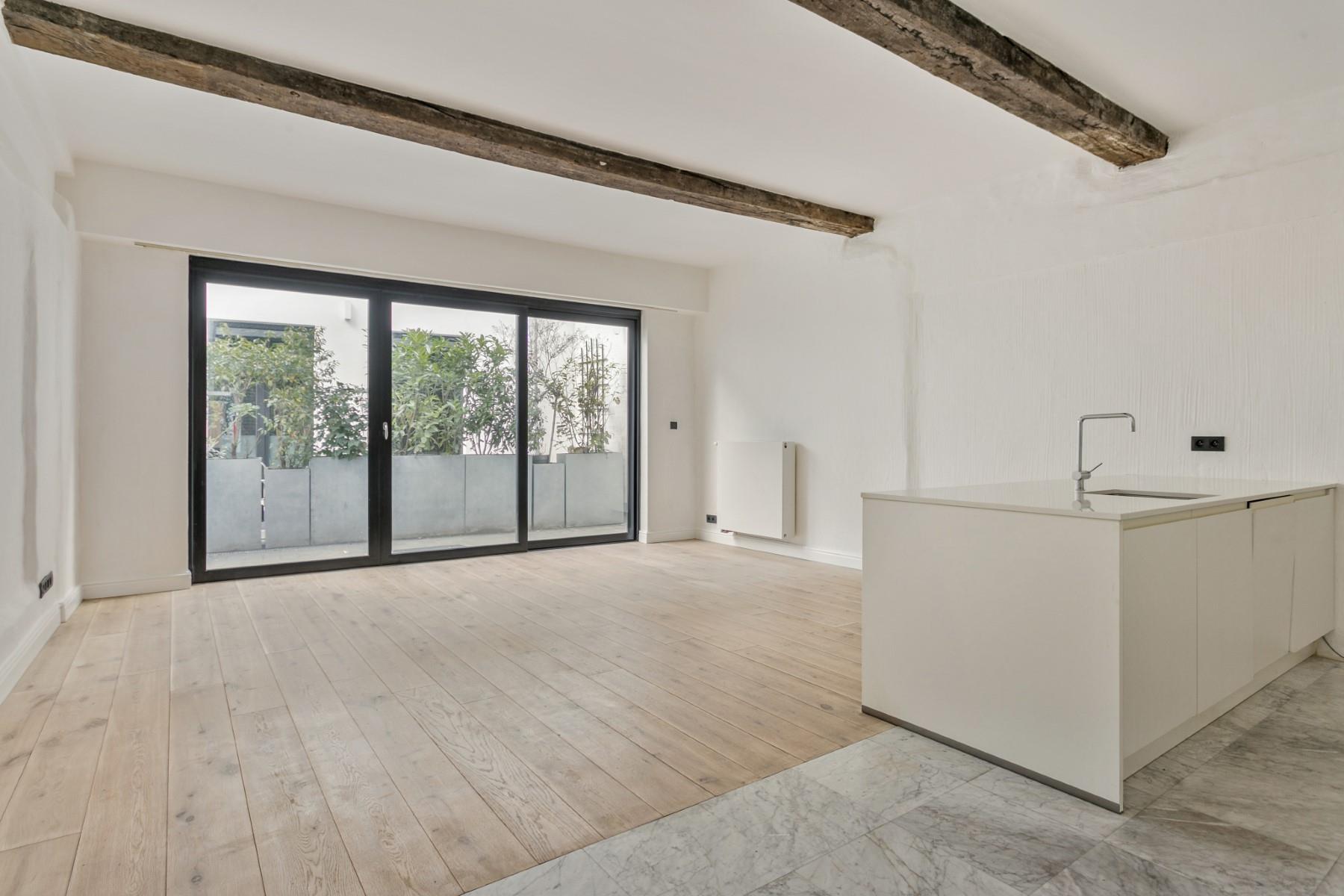 Totaal gerenoveerd LUXE appartement met stadstuin - foto 1