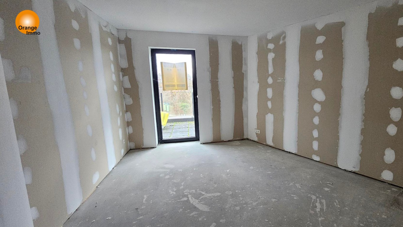 Nieuwbouwappartement met één slaapkamer gelegen in het commercieel en bruisend centrum van Eisden. Een appartement voor wie wil wonen in een gezellig en comfortabel complex voorzien van tal van faciliteiten. - foto 5