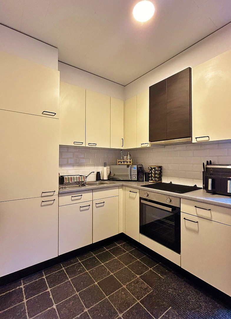 Gezellige rijwoning met koertje en zonnig terras - foto 4