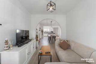 This recently and quality renovated house enjoys a quiet yet extremely central location within walking distance of the historic center of Bruges. Thanks to thoughtful renovations, the home is ready for a new chapter.<br /><br />Technically, the property features a certified electrical installation and holds a valid EPC certificate with an energy label B (198 kWh/m²).<br /><br />The layout of the house is as follows:<br /><br />On the ground floor, you will find a spacious and bright entrance hall that leads to the cozy living area with an open kitchen. The fully equipped kitchen offers all modern comforts, including a combination oven, dishwasher, induction cooktop, extractor hood, one-and-a-half sink, and a fridge with freezer compartment. Additionally, the ground floor includes a large storage/laundry room and a separate guest toilet.<br /><br />On the first floor, there is a night hall, two spacious bedrooms, and a well-maintained bathroom fitted with a bathtub with shower option, a sink with vanity, and a second toilet.<br /><br />A fixed staircase leads to the particularly spacious attic floor, which is ideal as an office, hobby room, or versatile extra space.<br /><br />At the back of the house, you will find a large terrace accessible via the central heating storage room, where you can enjoy the outdoors in complete peace and quiet.<br /><br />Highlights of this property:<br />• Energy-efficient character – EPC label B (198 kWh/m²)<br />• Certified electrical installation<br />• Move-in ready<br />• Quality renovations with high-end finishing<br />• Two spacious bedrooms<br />• Large attic with multiple possibilities<br />• Spacious terrace<br />• Quiet yet very central location near the center of Bruges<br />• Compliance certificate available<br /><br />More information or to schedule a visit? Contact our office.